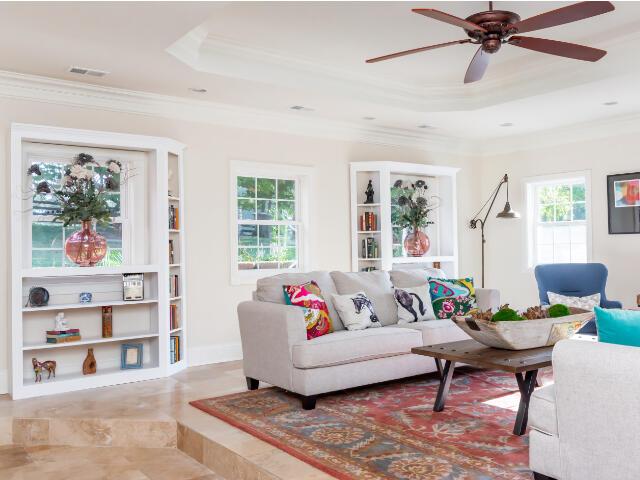 4950 Jennie Kate Ln, Lexington, KY 40510 - living room featuring a ceiling fan, a raised ceiling, crown molding, and visible vents