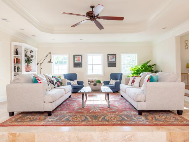 4950 Jennie Kate Ln, Lexington, KY 40510 - living area with a ceiling fan, a raised ceiling, and crown molding