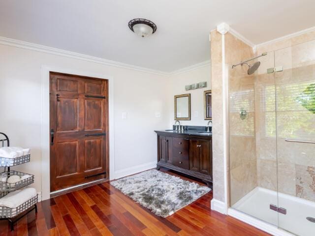 4950 Jennie Kate Ln, Lexington, KY 40510 - bathroom featuring ornamental molding, a stall shower, and wood finished floors
