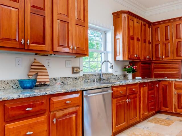 4950 Jennie Kate Ln, Lexington, KY 40510 - kitchen featuring dishwasher, light stone countertops, a sink, and crown molding