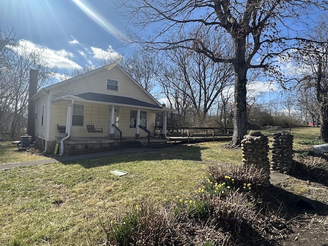 34 Bridge Fork Rd, Whitley City, KY 42653 - bungalow-style home with covered porch, central AC, and a front lawn