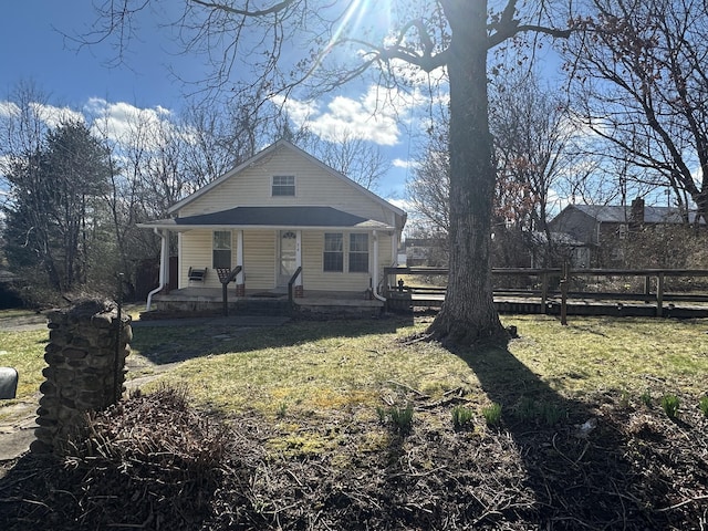 34 Bridge Fork Rd, Whitley City, KY 42653 - view of front facade with fence, a porch, and a front yard