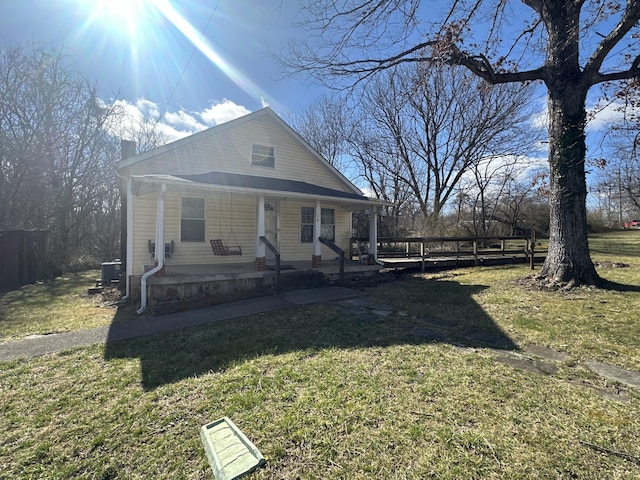 34 Bridge Fork Rd, Whitley City, KY 42653 - bungalow-style house featuring cooling unit, a front yard, and covered porch