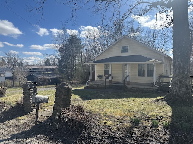 34 Bridge Fork Rd, Whitley City, KY 42653 - bungalow-style home with a front yard and covered porch
