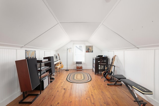 interior space with hardwood / wood-style flooring and lofted ceiling