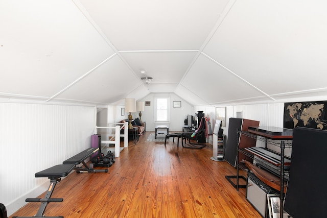 exercise area with hardwood / wood-style floors and lofted ceiling