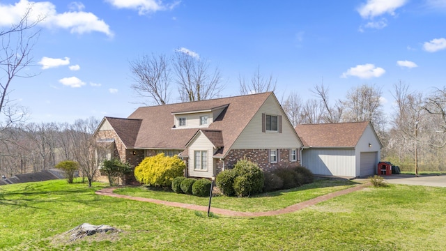29 Quails Run Ln, West Liberty, KY 41472 - view of front of home featuring driveway, a front yard, brick siding, a garage, and roof with shingles