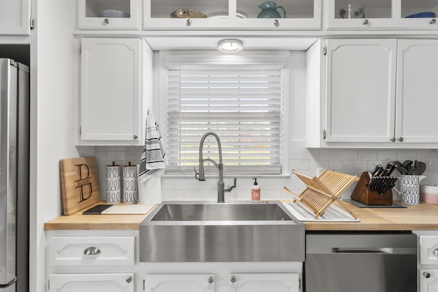 29 Quails Run Ln, West Liberty, KY 41472 - kitchen featuring appliances with stainless steel finishes, a sink, white cabinetry, and glass insert cabinets