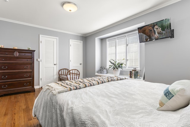 29 Quails Run Ln, West Liberty, KY 41472 - bedroom featuring crown molding, dark wood-style floors, and two closets