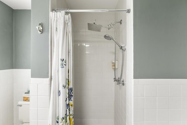 29 Quails Run Ln, West Liberty, KY 41472 - bathroom with tiled shower, tile walls, and wainscoting