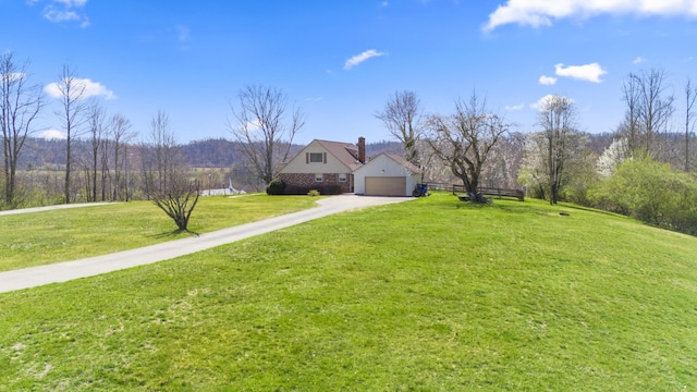 29 Quails Run Ln, West Liberty, KY 41472 - view of front of home featuring concrete driveway, a chimney, and a garage