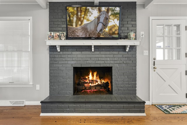 29 Quails Run Ln, West Liberty, KY 41472 - detailed view of wood finished floors, a brick fireplace, and baseboards