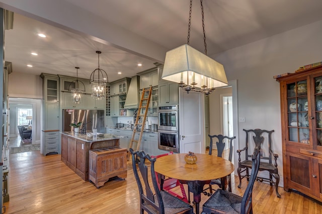 443 Hutchison Rd, Paris, KY 40361 - dining room with light wood finished floors, a notable chandelier, and recessed lighting