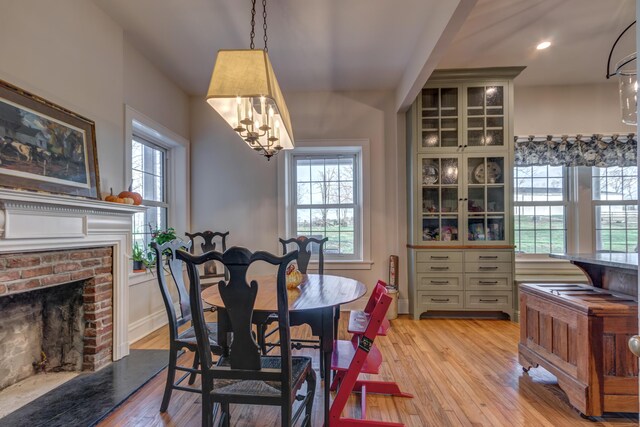 443 Hutchison Rd, Paris, KY 40361 - dining room featuring a notable chandelier, light wood-style floors, recessed lighting, and a fireplace