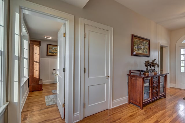 443 Hutchison Rd, Paris, KY 40361 - hallway with light wood finished floors, a decorative wall, and a wainscoted wall