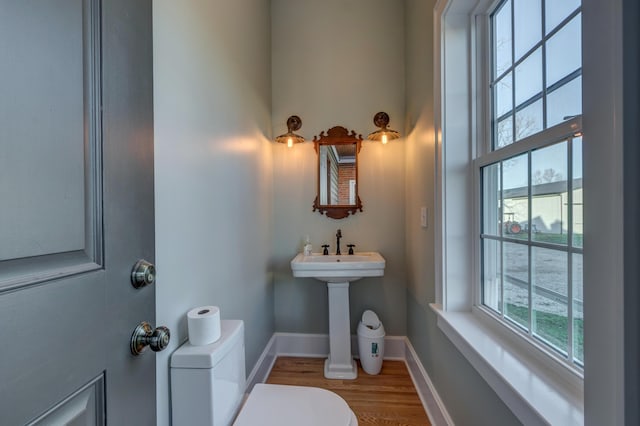 443 Hutchison Rd, Paris, KY 40361 - bathroom featuring baseboards, toilet, and wood finished floors