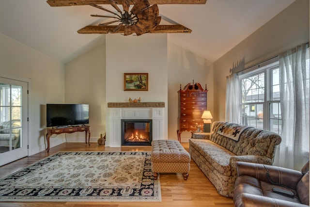 443 Hutchison Rd, Paris, KY 40361 - living area with light wood-style flooring, a healthy amount of sunlight, a glass covered fireplace, and beamed ceiling