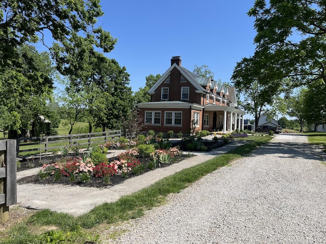 443 Hutchison Rd, Paris, KY 40361 - view of front of property with driveway, brick siding, fence, and a chimney