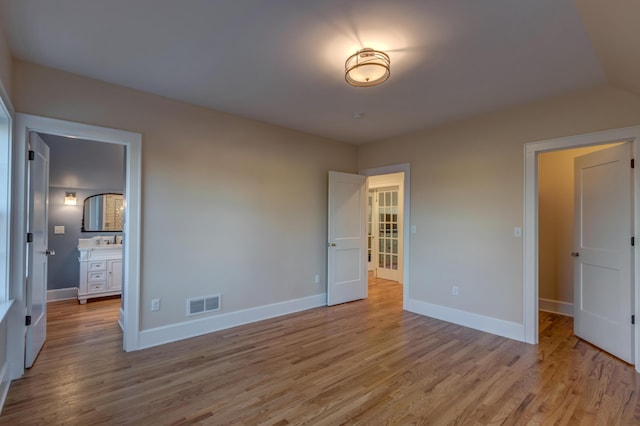 443 Hutchison Rd, Paris, KY 40361 - unfurnished bedroom featuring light wood-type flooring, baseboards, and visible vents