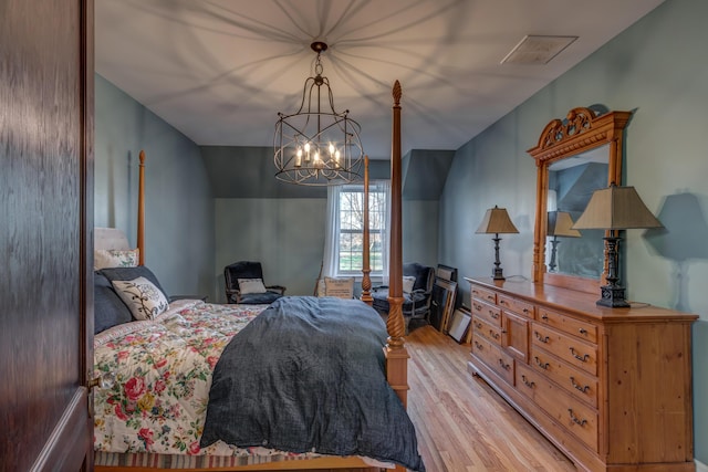 443 Hutchison Rd, Paris, KY 40361 - bedroom with a notable chandelier and light wood-type flooring