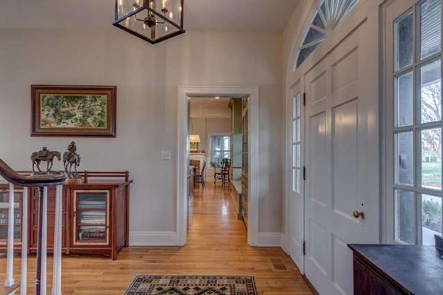 443 Hutchison Rd, Paris, KY 40361 - foyer entrance featuring baseboards, a chandelier, and light wood-type flooring