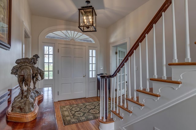 443 Hutchison Rd, Paris, KY 40361 - entryway featuring a notable chandelier, wood finished floors, and stairway