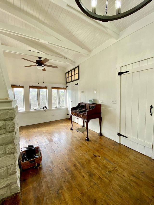 interior space with beam ceiling, wood ceiling, hardwood / wood-style flooring, and ceiling fan