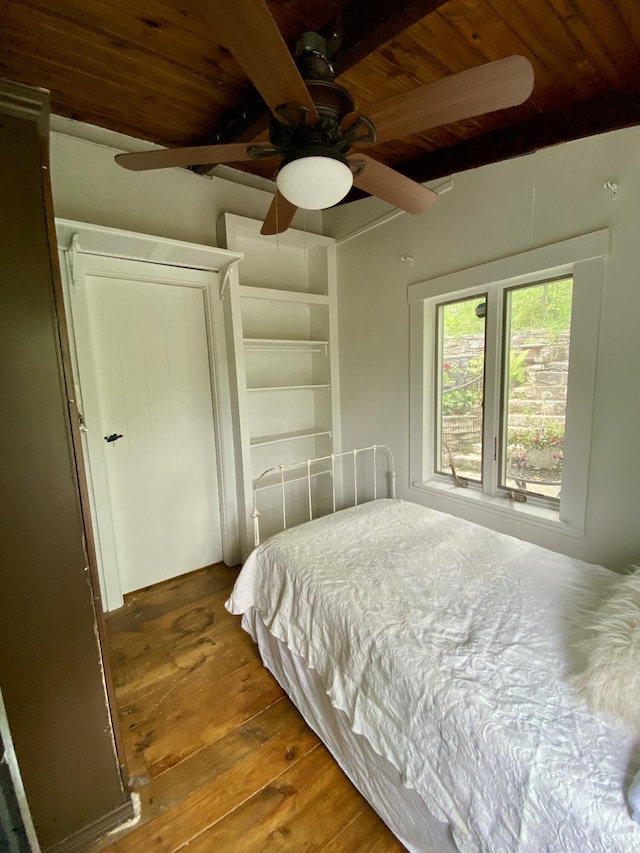 bedroom with ceiling fan, wooden ceiling, beam ceiling, and hardwood / wood-style floors