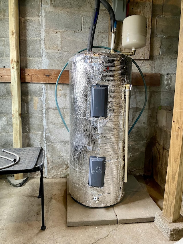 utility room featuring water heater