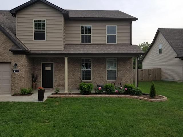 traditional home with brick siding, fence, a shingled roof, and a front yard