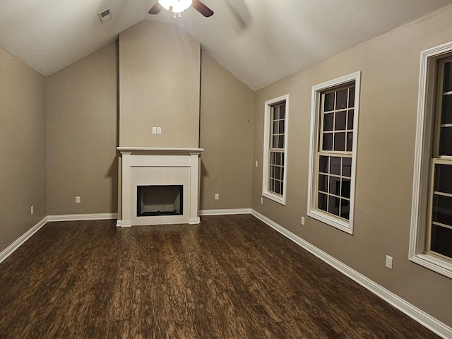 unfurnished living room featuring ceiling fan, vaulted ceiling, wood finished floors, and visible vents