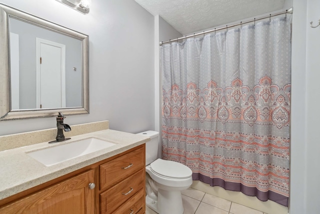 full bathroom with vanity, toilet, a shower with shower curtain, a textured ceiling, and tile patterned floors