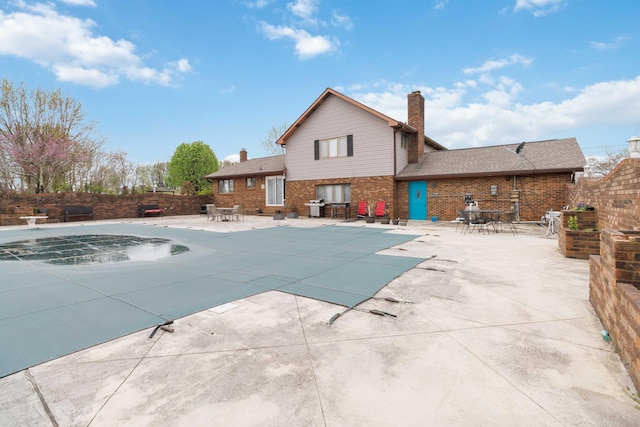view of pool with a grill, fence, a patio, and a fenced in pool