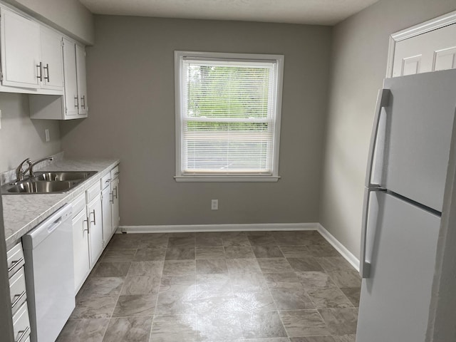 933 N Broadway Unit 2, Lexington, KY 40505 - kitchen with a sink, white cabinetry, baseboards, white appliances, and light countertops