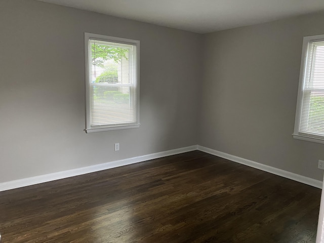 933 N Broadway Unit 2, Lexington, KY 40505 - empty room featuring dark wood-style flooring, a wealth of natural light, and baseboards