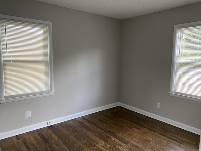 933 N Broadway Unit 2, Lexington, KY 40505 - unfurnished room with baseboards and dark wood-style flooring