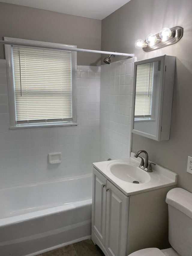 933 N Broadway Unit 2, Lexington, KY 40505 - bathroom with shower / bathing tub combination, vanity, toilet, and plenty of natural light
