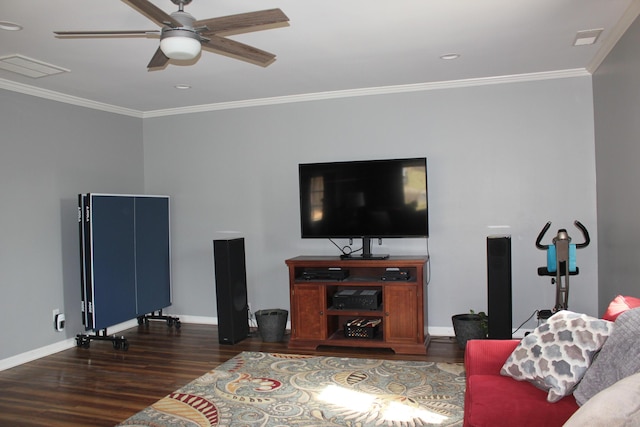 living room featuring baseboards, wood finished floors, ornamental molding, and a ceiling fan