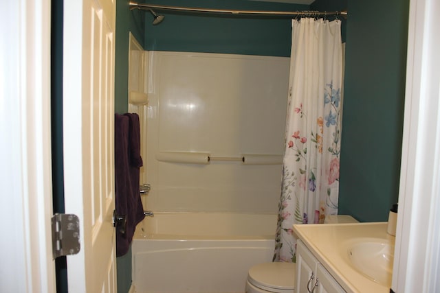 bathroom featuring shower / tub combo with curtain, toilet, and vanity