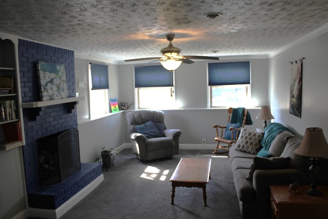living room featuring a textured ceiling, carpet floors, ornamental molding, and a ceiling fan