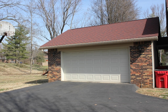 garage featuring driveway