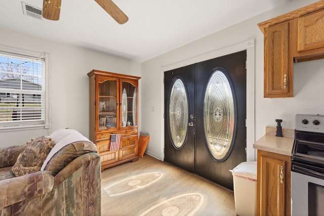58 Mcclendon Ln, Russell Springs, KY 42642 - entrance foyer featuring light wood-type flooring, a ceiling fan, and french doors