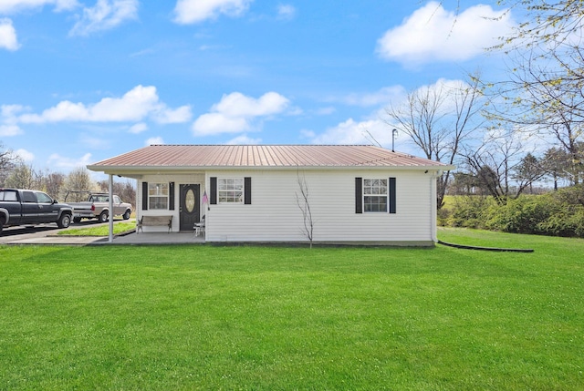 58 Mcclendon Ln, Russell Springs, KY 42642 - back of house featuring a lawn and metal roof