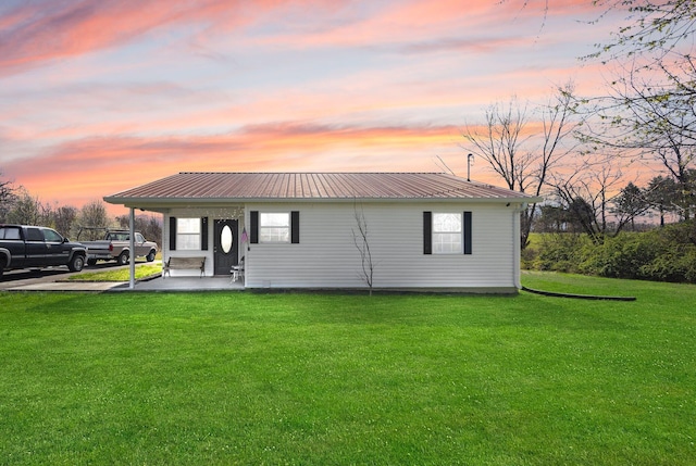 58 Mcclendon Ln, Russell Springs, KY 42642 - back of property with a lawn and metal roof