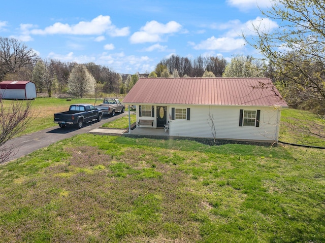 58 Mcclendon Ln, Russell Springs, KY 42642 - back of property featuring metal roof, a yard, and driveway