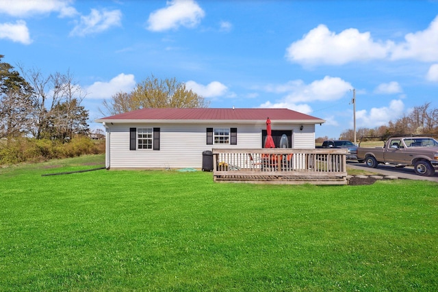 58 Mcclendon Ln, Russell Springs, KY 42642 - back of property with a wooden deck, metal roof, and a lawn