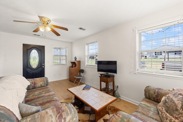 58 Mcclendon Ln, Russell Springs, KY 42642 - living area with wood finished floors, ceiling fan, and baseboards
