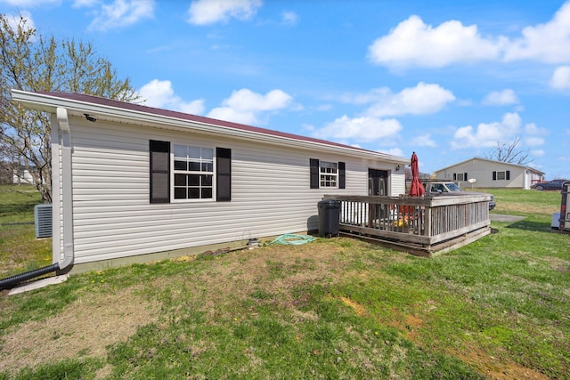 58 Mcclendon Ln, Russell Springs, KY 42642 - rear view of property featuring a deck, a lawn, and cooling unit