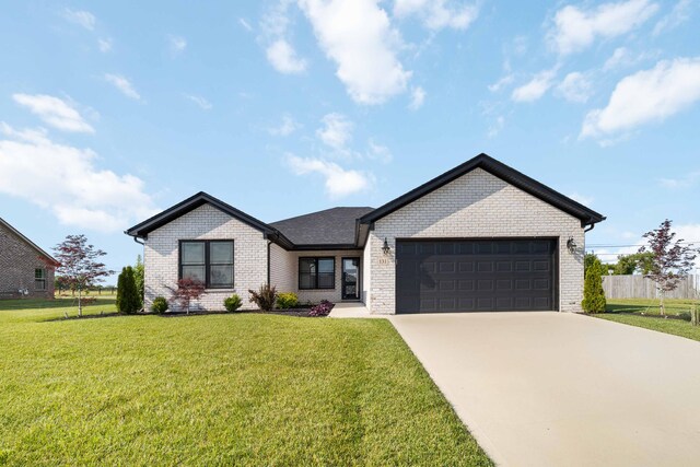 131 Patriot Trl, Berea, KY 40403 - ranch-style house with brick siding, an attached garage, a front lawn, driveway, and roof with shingles