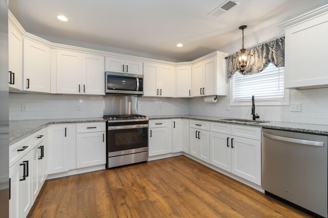 131 Patriot Trl, Berea, KY 40403 - living room with a ceiling fan, recessed lighting, a chandelier, beam ceiling, and wood finished floors